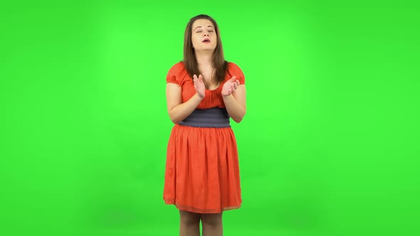 Cute Girl Clapping Her Hands Indifferent. Green Screen alt