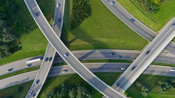 Rotating aerial top-down view of three level road junction, Stock Footage