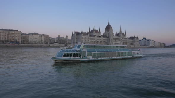 Blue ship floating on Danube River alt