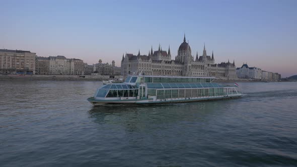Blue ship floating on Danube River