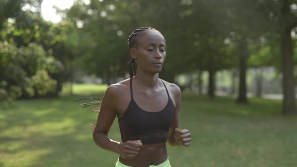 Sporty African American Woman Running Outdoors alt