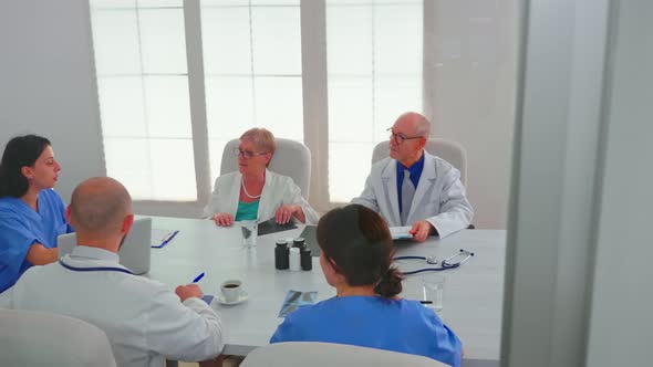 Healthcare Workers Having Meeting in Hospital Conference Room alt