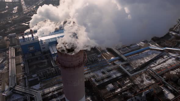 Emission carbon gases from factory pipes with smoke in atmosphere alt