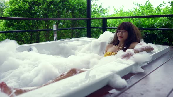 Cute Smiling Asian Girl in Bikini Having Fun in Hot Tube Thailand