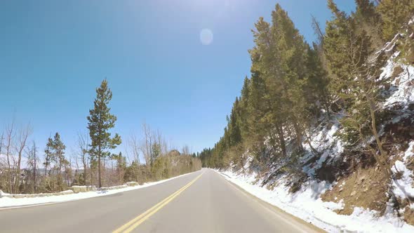 POV point of view -Driving through Rocky Mountain National Park in the Spring. alt