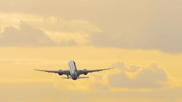 Airplane Climb at Sunset
