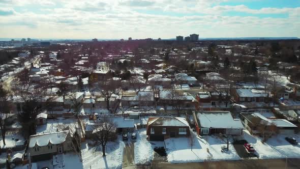Winter aerial view of a snow covered residential community in Oakville, Ontario, Canada. alt