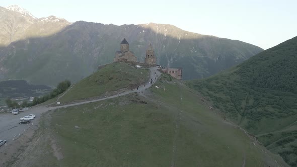 Stepantsminda, Georgia - May 8 2021: Aerial view of Gergeti Trinity Church, Tsminda Sameba. Kazbegi alt