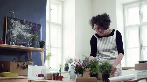 Florist packing box with flowers ordered by client alt