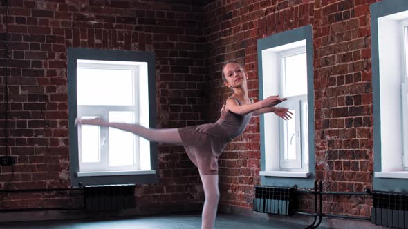 A Ballerina Girl Training Her Dancing in the Light Studio alt