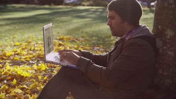 College student on campus using laptop computer