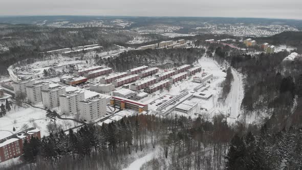 Modern Residential Urban Area Surrounded By Forest at Winter Aerial alt