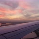 Plane landing in New York at beautiful sunset
