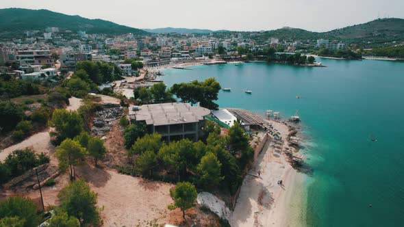 Aerial View Azure Beach with Empty Sun Loungers Balkan Coast Ionian Sea Albania alt