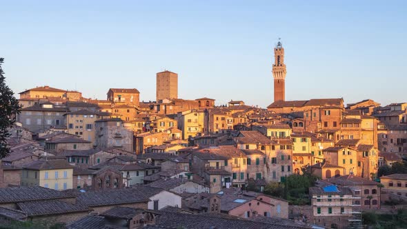 Day to night time lapse cityscape of Siena, Italy