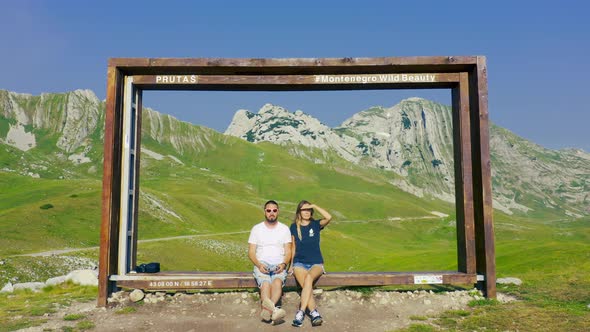 Beautiful Couple Sit in Mountain Prutas at National Park Durmitor Montenegro alt