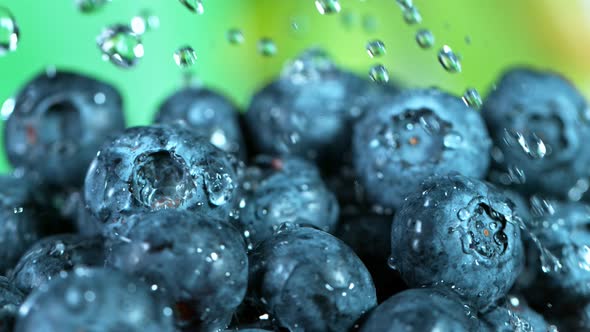 Super Slow Motion Shot of Water Falling on Fresh Blueberries at 1000Fps alt