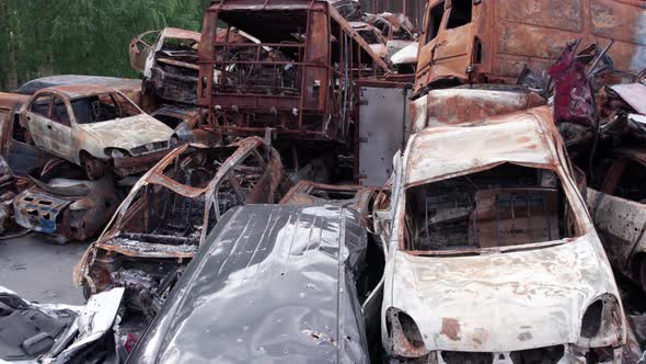War in Ukraine a Dump of Shot and Burned Cars in Irpin Bucha District alt