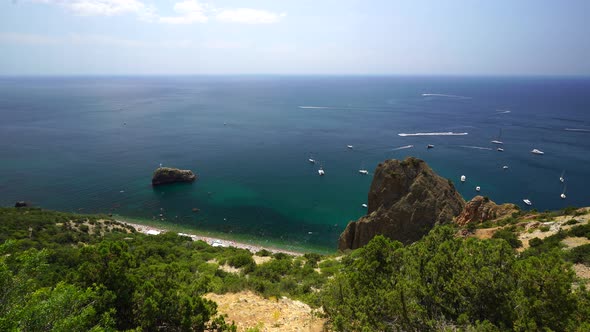 Aerial Panoramic View of Seascape with Crystal Clear Azure Sea and Rocky Shores alt