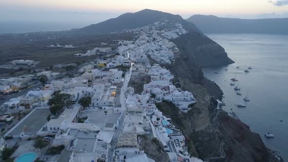 Aerial View Flying Over City of Oia on Santorini Greece alt