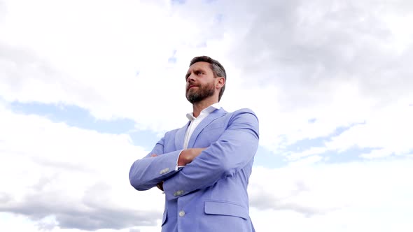 Serious Manager in Formal Suit Keep Arms Crossed with Confidence on Sky Professional