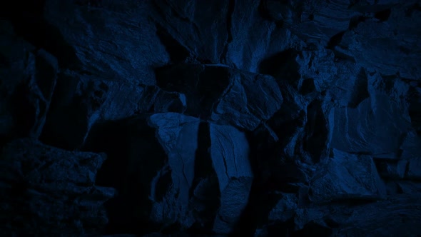 Passing Jagged Rock Face At Night alt