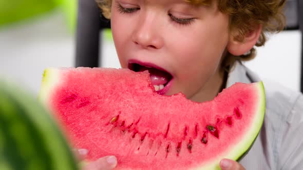 Funny Curly Boy Eats Watermelon