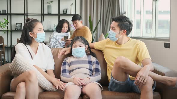 asian family multi generation wearing surgical facial mask together alt