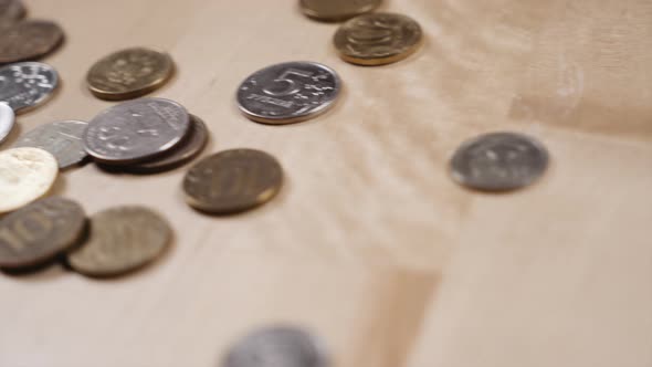 panoramic shooting of coins lying on the table alt