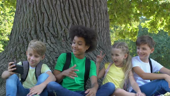 Happy Children Posing Selfie Showing Rock Gesture Taking Photo With Smartphone