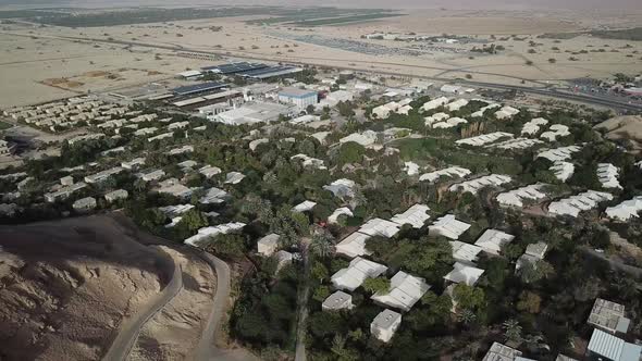 Aerial: top view of the small village of Yotvata in the middle of the desert, Israel alt