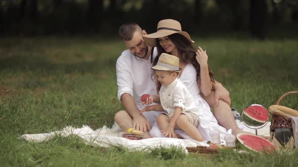 Young Caucasian Family with One Child Spend a Lot of Time Together and Have a Lot of Fun