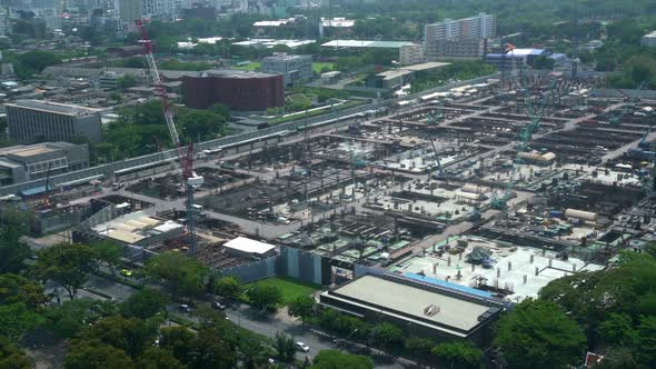 Large Construction Site with Heavy Construction Machinery in Metropolis alt