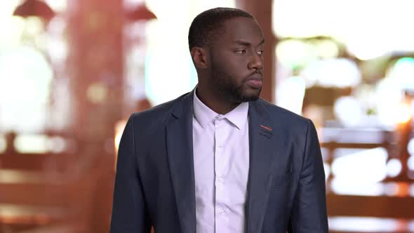 Portrait of Businessman Is Waiting for Someone. alt