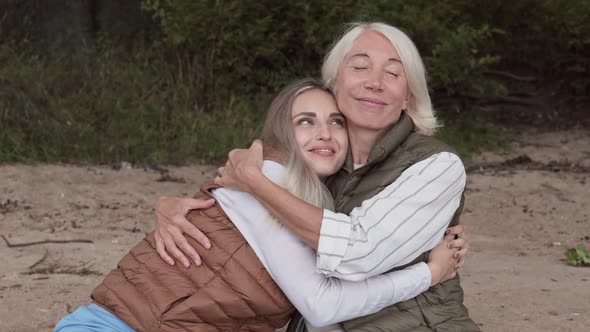 Loving Mom and Daughter Embracing alt