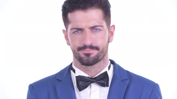 Face of Serious Young Bearded Businessman Nodding Head No alt