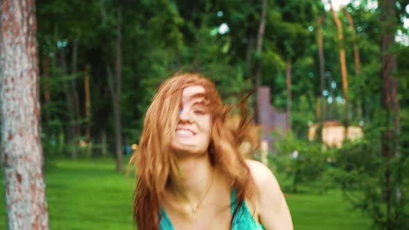 Happy Red Haired Girl with Wet Hair and Clothes Celebrates Holi Colors Holiday alt