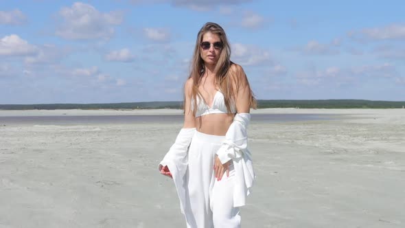 Beautiful Woman Walking on Shore