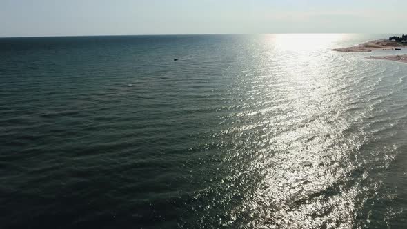 Aerial Shot of Beautiful Sun Path on the Black Sea Waves at Sunset in Summer