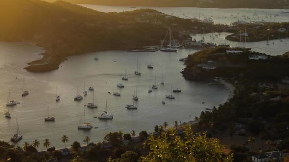 Top View Huge Harbor with Luxurious Sailboats Catamarans Sunset Golden Hour