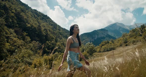 Smile Attractive Traveler Woman Climb Mountain on Meadow During Summer Journey alt