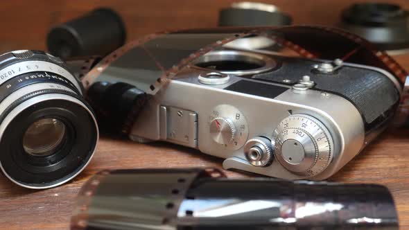 Retro Photo Camera with Photographic Film and Lens alt