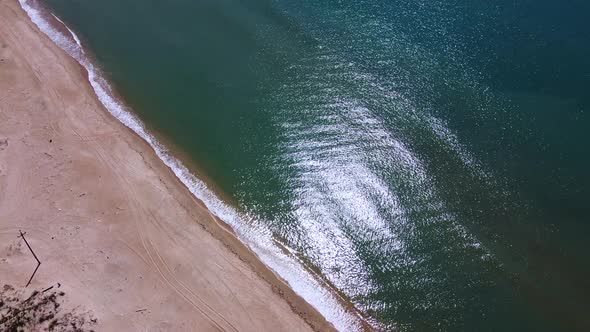 Seascape, calm sea, sandy beach, aerial view
