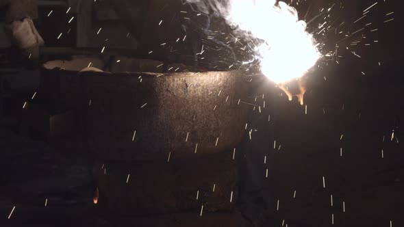 The Molten Metal Is Poured Out Of The Bowl