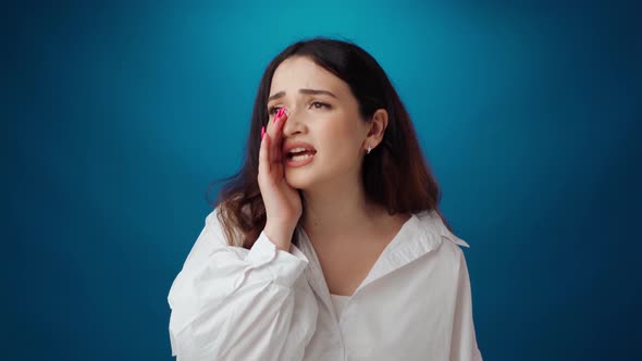 Young Attractive Woman Shouting Against Blue Background