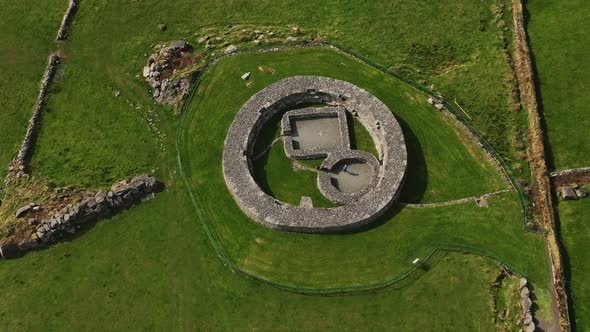 Loher Ringfort, Kerry, Ireland, March 2022. Drone orbits the ancient monument from the southeast in alt