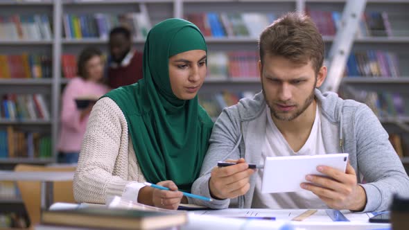 Diverse Students Researching Online on Tablet Pc alt