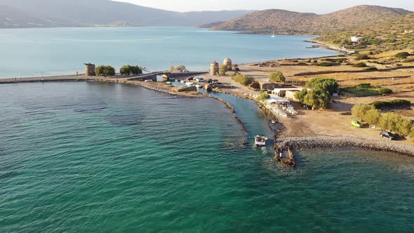 Aerial View of a Motor Boat in a Deep Blue Colored Sea. Kolokitha Island, Crete, Greece