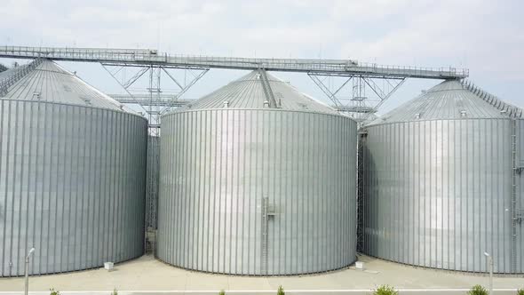 Grain elevator in agricultural zone. Row of granaries for storing wheat ...