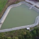 Aerial view of &quot;Embung Imogiri&quot; a pond with a puppet-like shape in the Bantul area, Yogyakarta - VideoHive Item for Sale